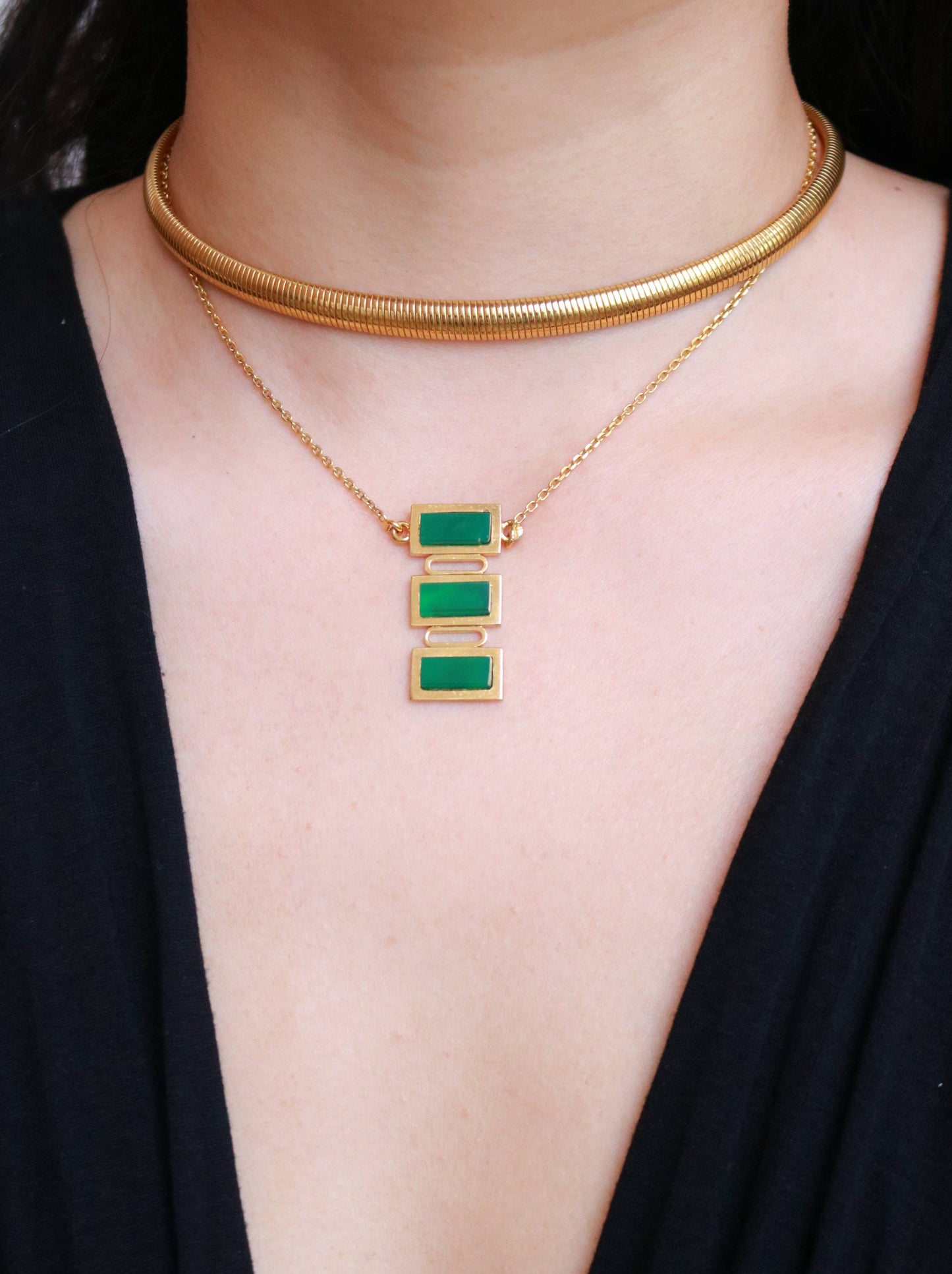 Vintage vermeil and green jade geometric pendant necklace worn to showcase its elegant 38 cm length.