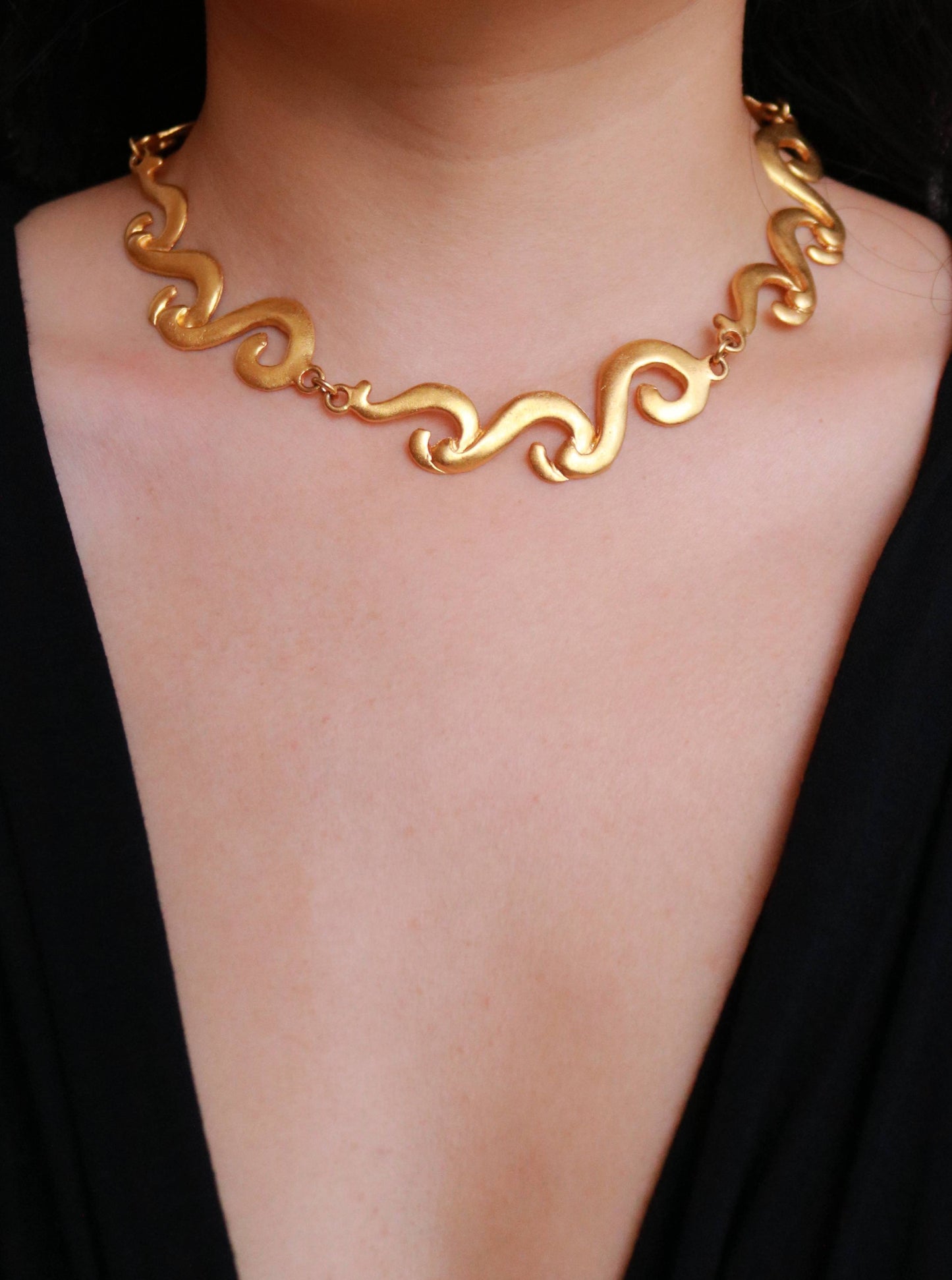Authentic vintage Multiples gold-tone statement necklace worn on model, showcasing timeless French 1980s design.