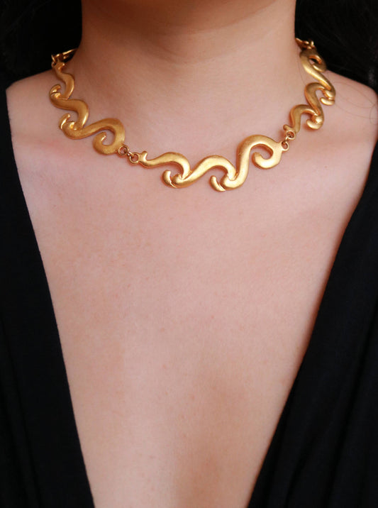 Authentic vintage Multiples gold-tone statement necklace worn on model, showcasing timeless French 1980s design.