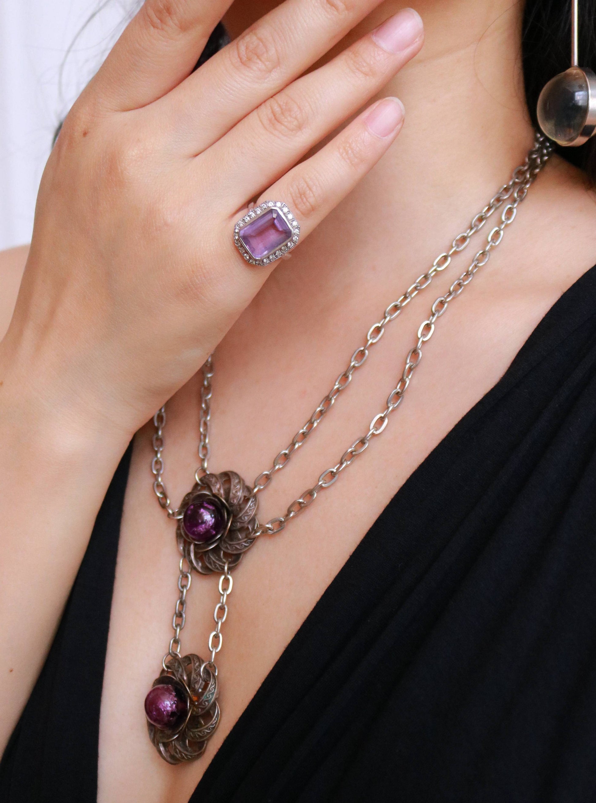 Vintage 925 sterling silver amethyst halo statement ring in EU size 52 and US size 6 worn on the hand.