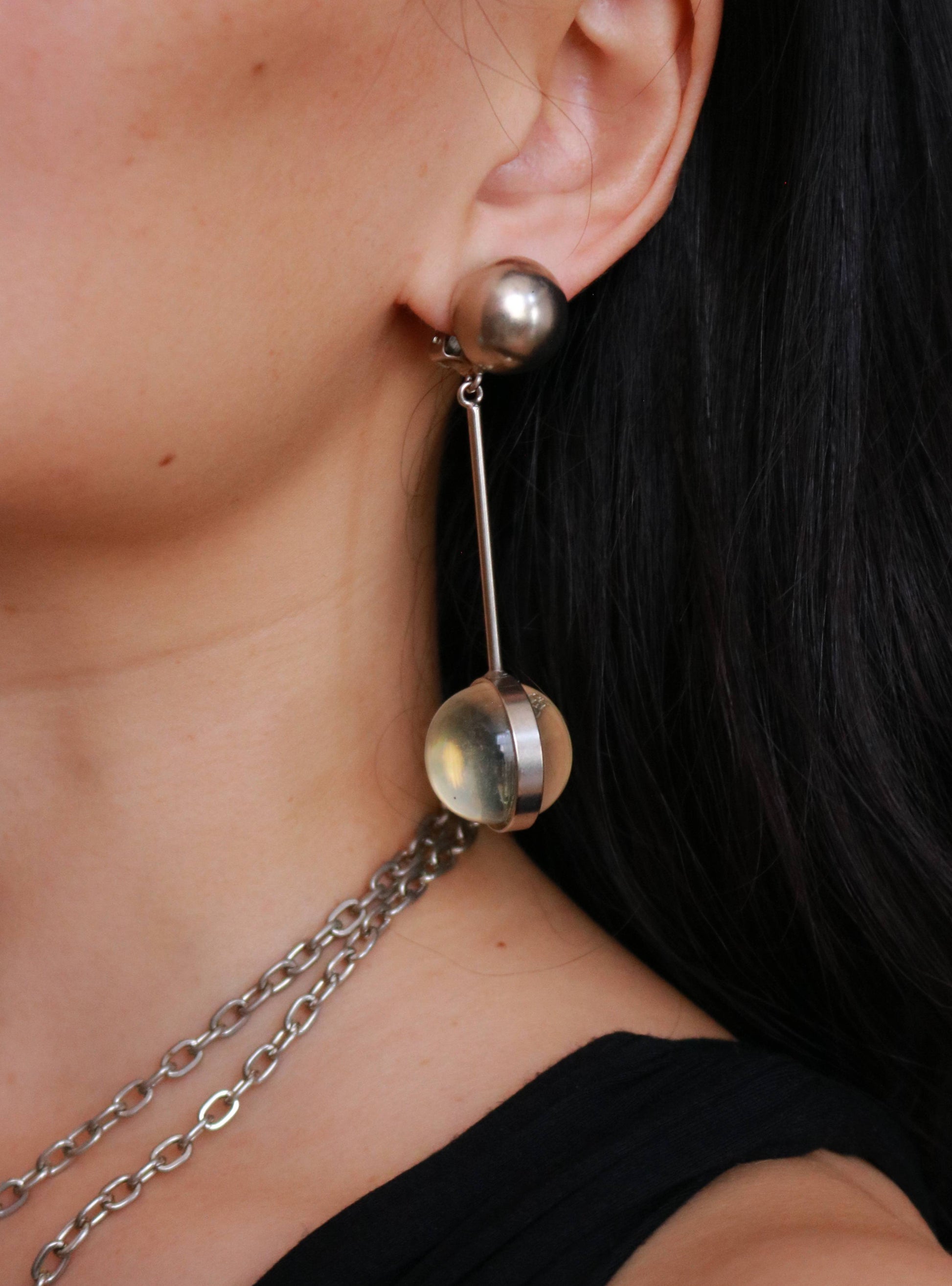 Long 1970s vintage resin ball clip-on earrings with a bold geometric statement design.