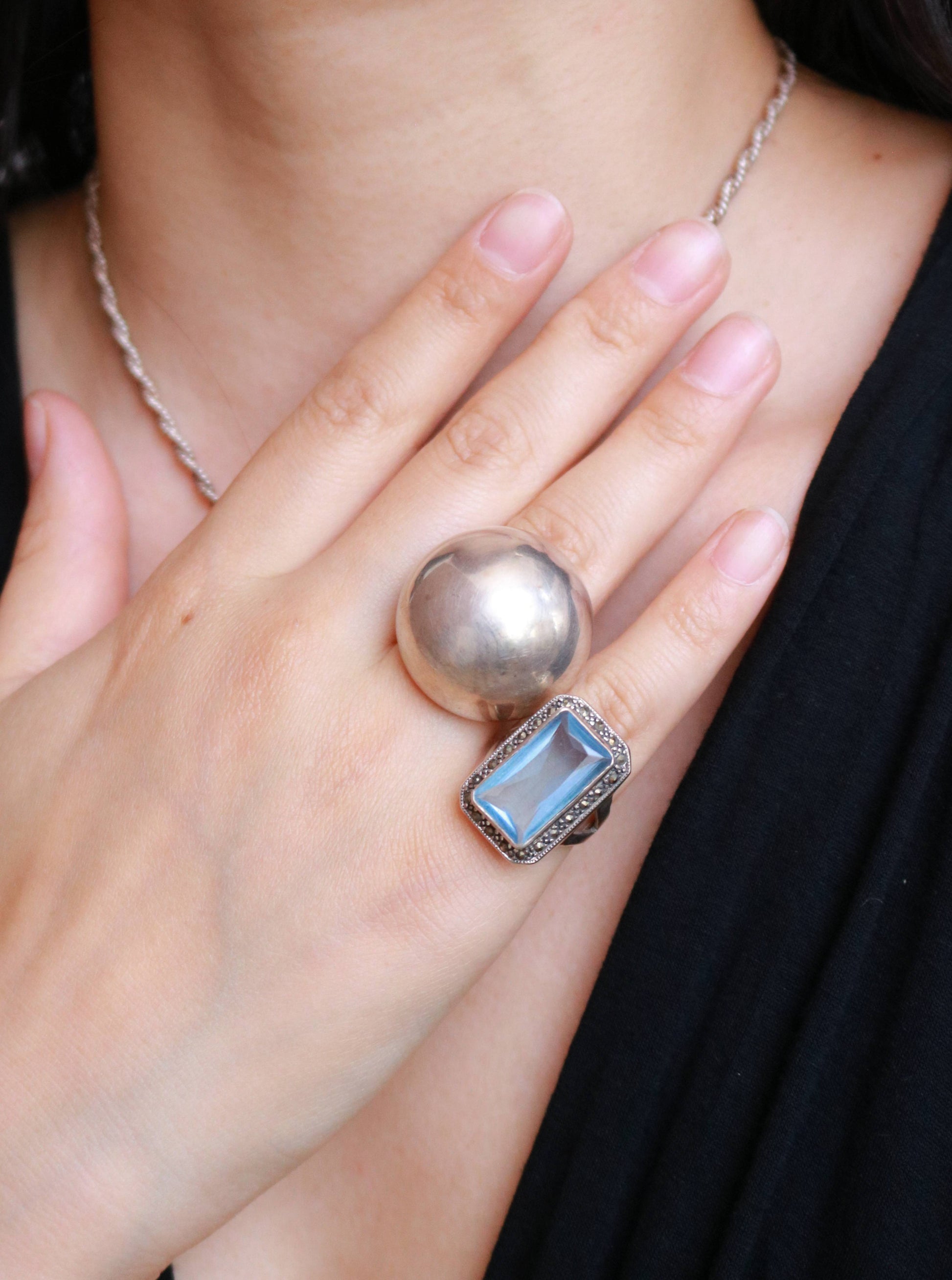 Vintage 925 sterling silver modernist dome statement ring in EU size 56 and US size 7.5 worn on the hand.