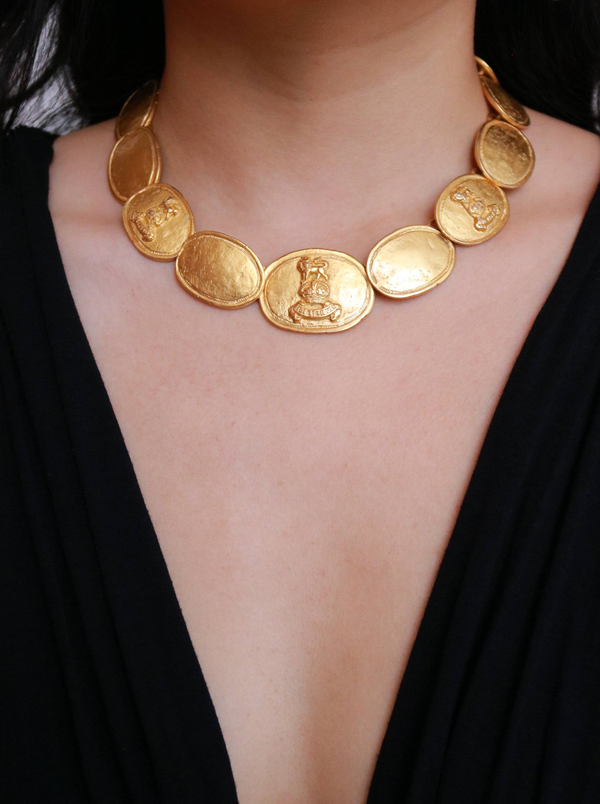 Vintage Laurès medallion necklace worn on model, showcasing its elegant French design and timeless vintage character.