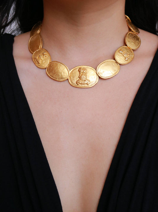 Vintage Laurès medallion necklace worn on model, showcasing its elegant French design and timeless vintage character.