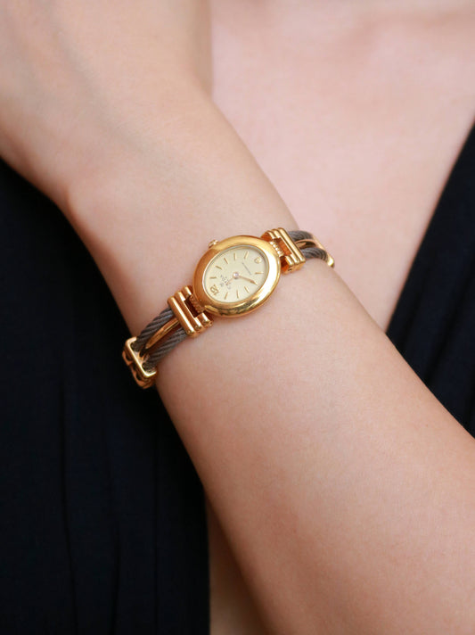 Vintage Clyda Paris bicolor bracelet watch worn on the wrist, showcasing its elegant jewelry-inspired design.