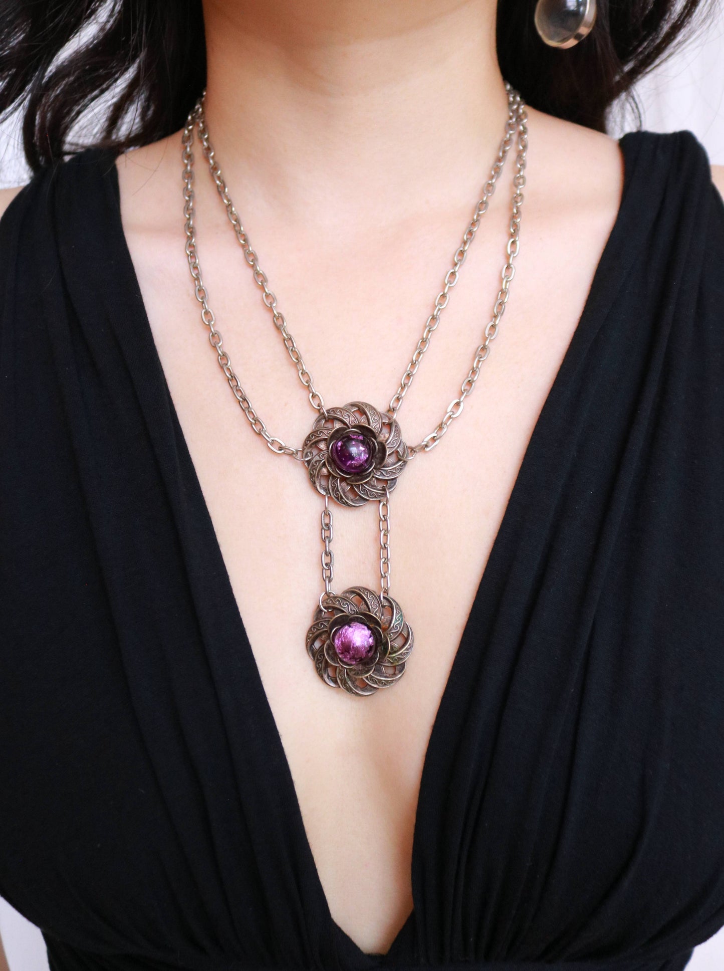 Vintage purple Murano glass floral drop necklace with an elegant layered chain and elongated pendant design.