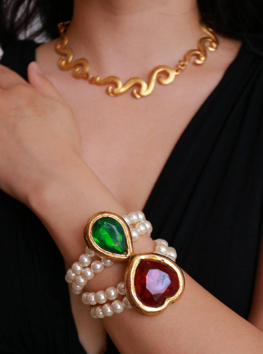 Vintage YSL Style faux pearl bracelet worn on model, showcasing elegant 1970s French vintage design.