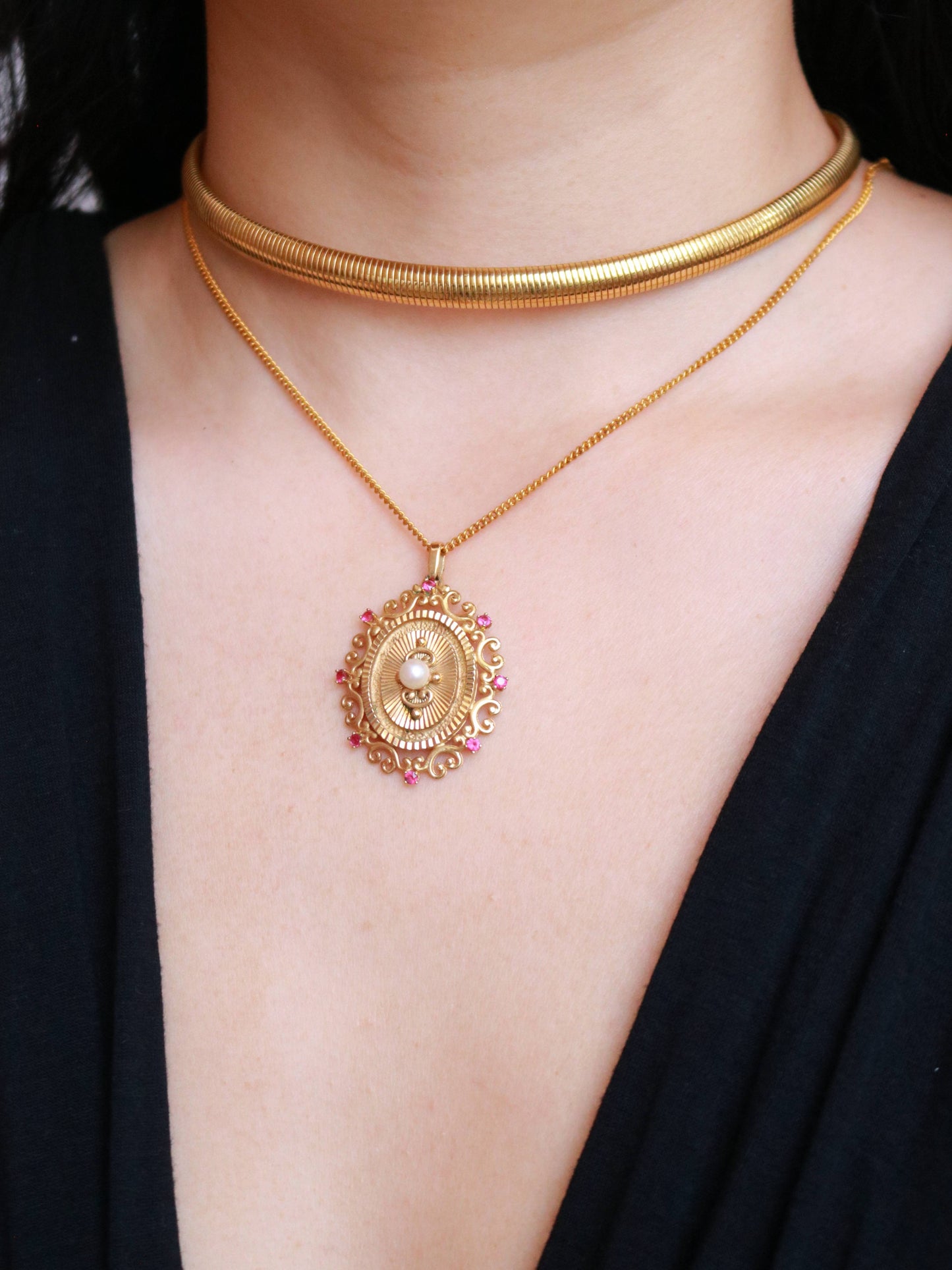 Vintage FIX gold plated pendant necklace worn to showcase its elegant proportions and ornate design.