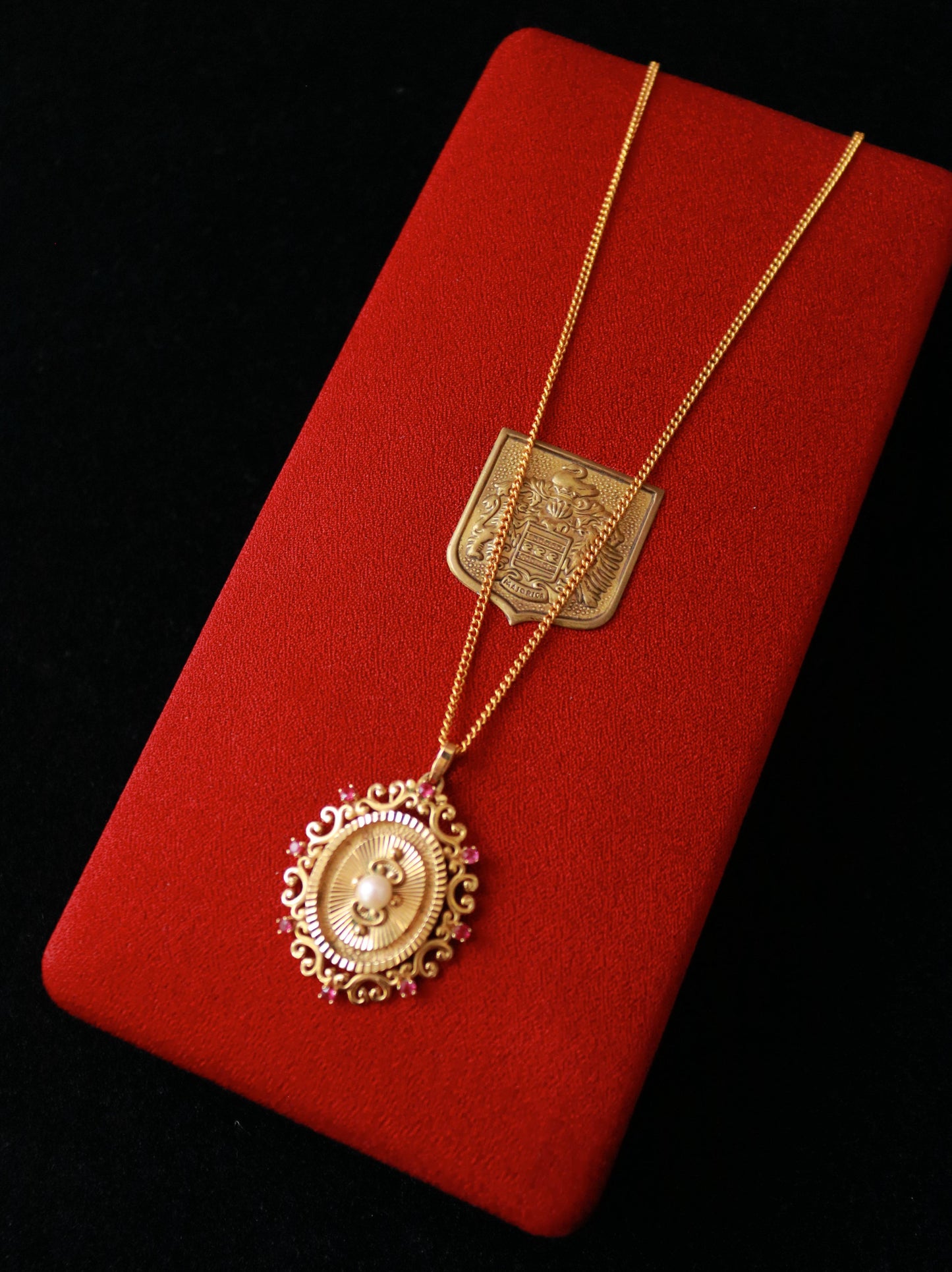 Vintage FIX gold plated ornate pendant necklace with faux pearl and red crystal accents.