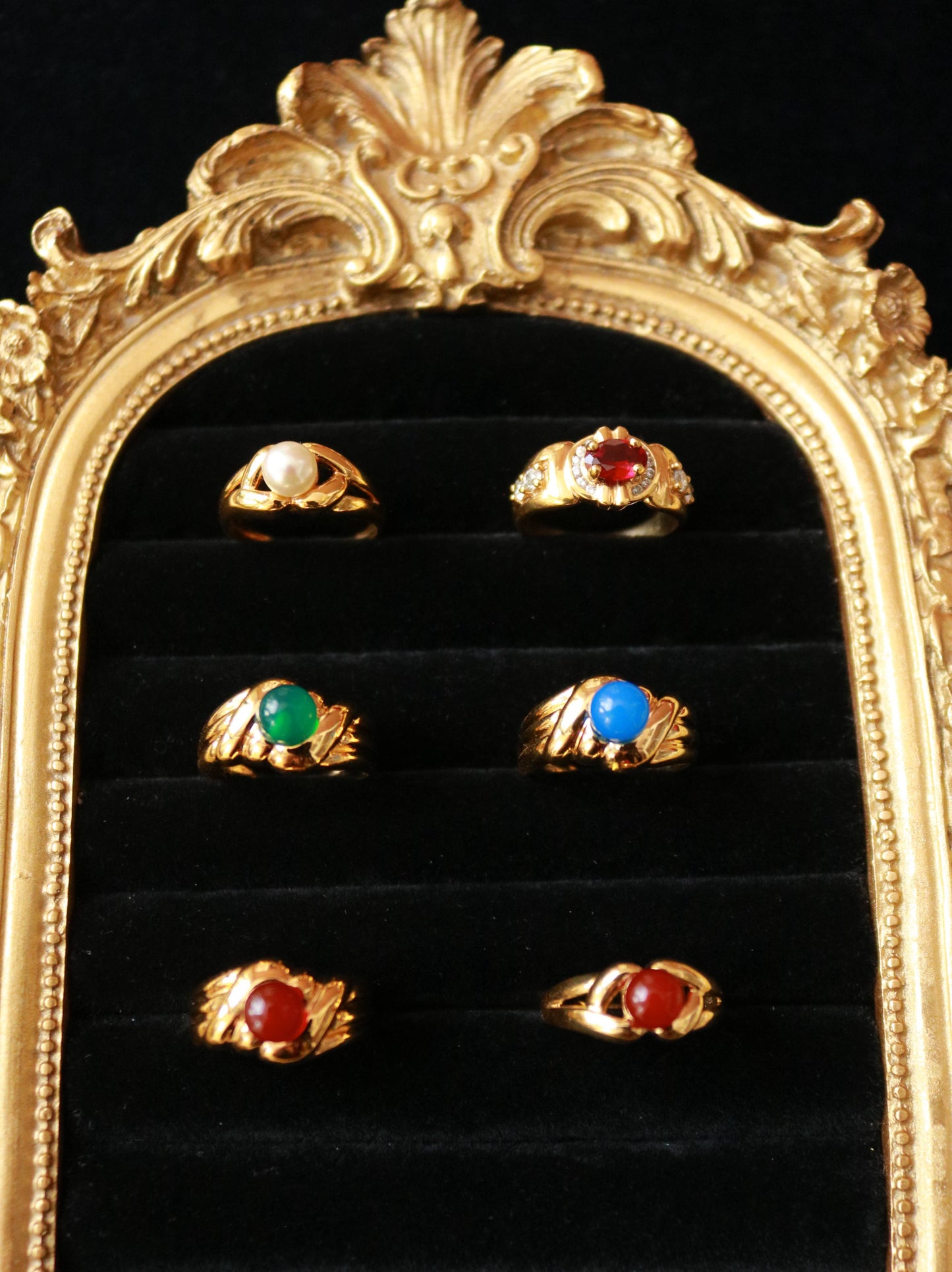 Close-up of vintage vermeil ring featuring a polished natural green agate cabochon and double French hallmarks.