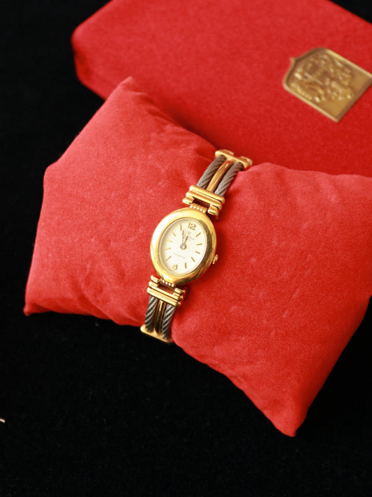 Vintage Clyda Paris bicolor gold plated cable bracelet watch.