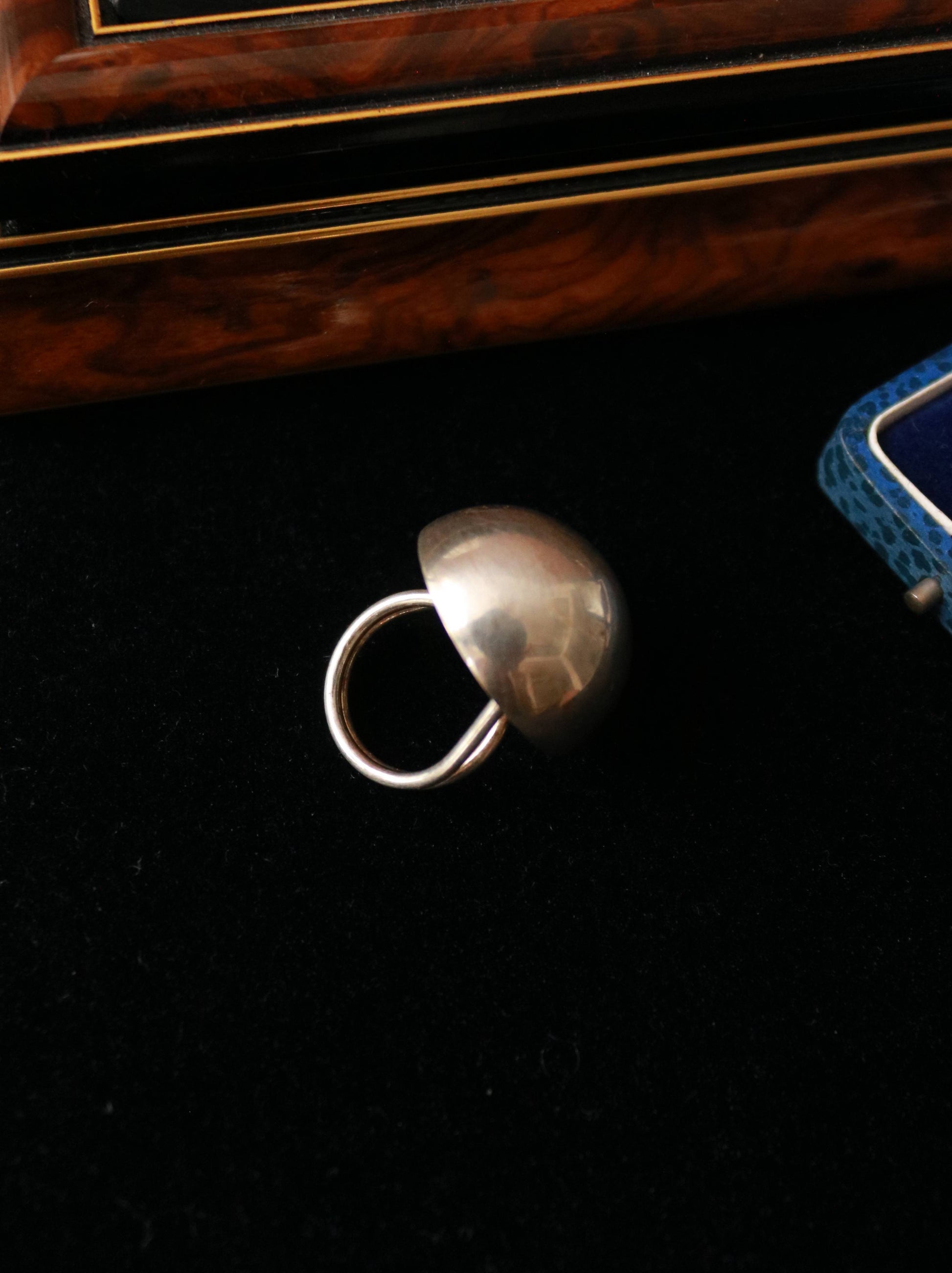 Side view of a vintage 925 sterling silver dome ring showing its sculptural oversized profile.