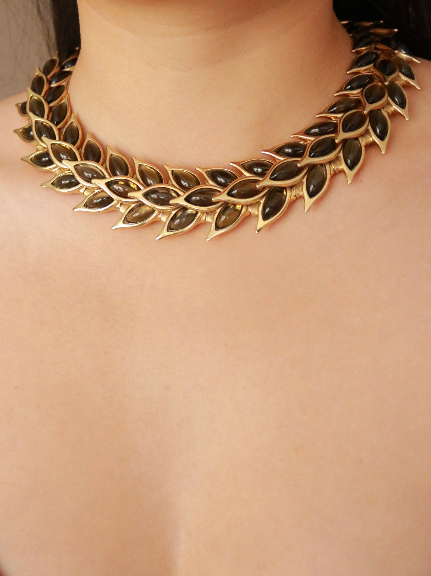 Authentic Yves Saint Laurent necklace by Robert Goossens worn on model, 1990s vintage French designer jewelry.