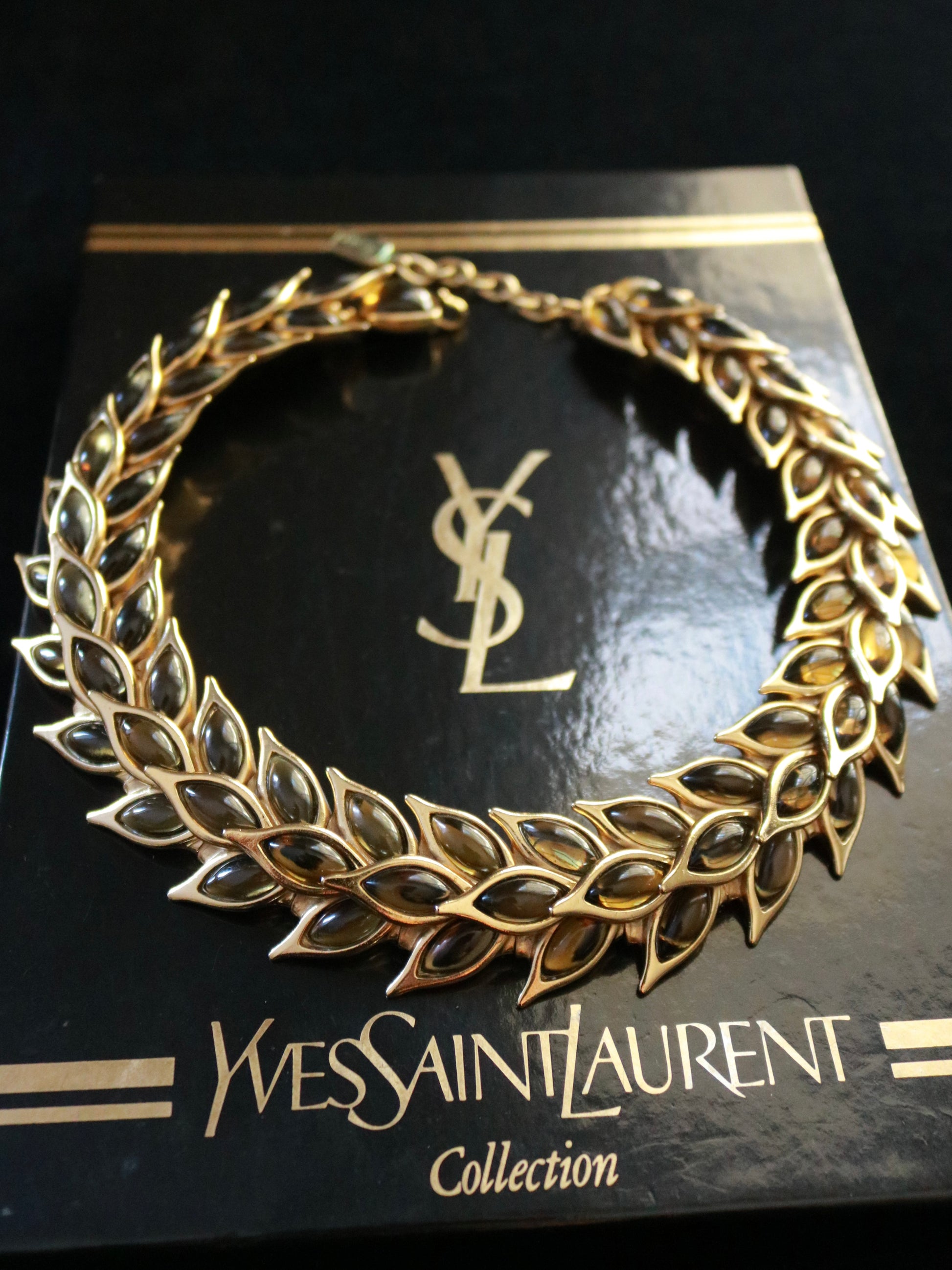 Authentic Yves Saint Laurent necklace by Robert Goossens, 1990s, featuring pale green glass cabochons and presented with its original YSL box.