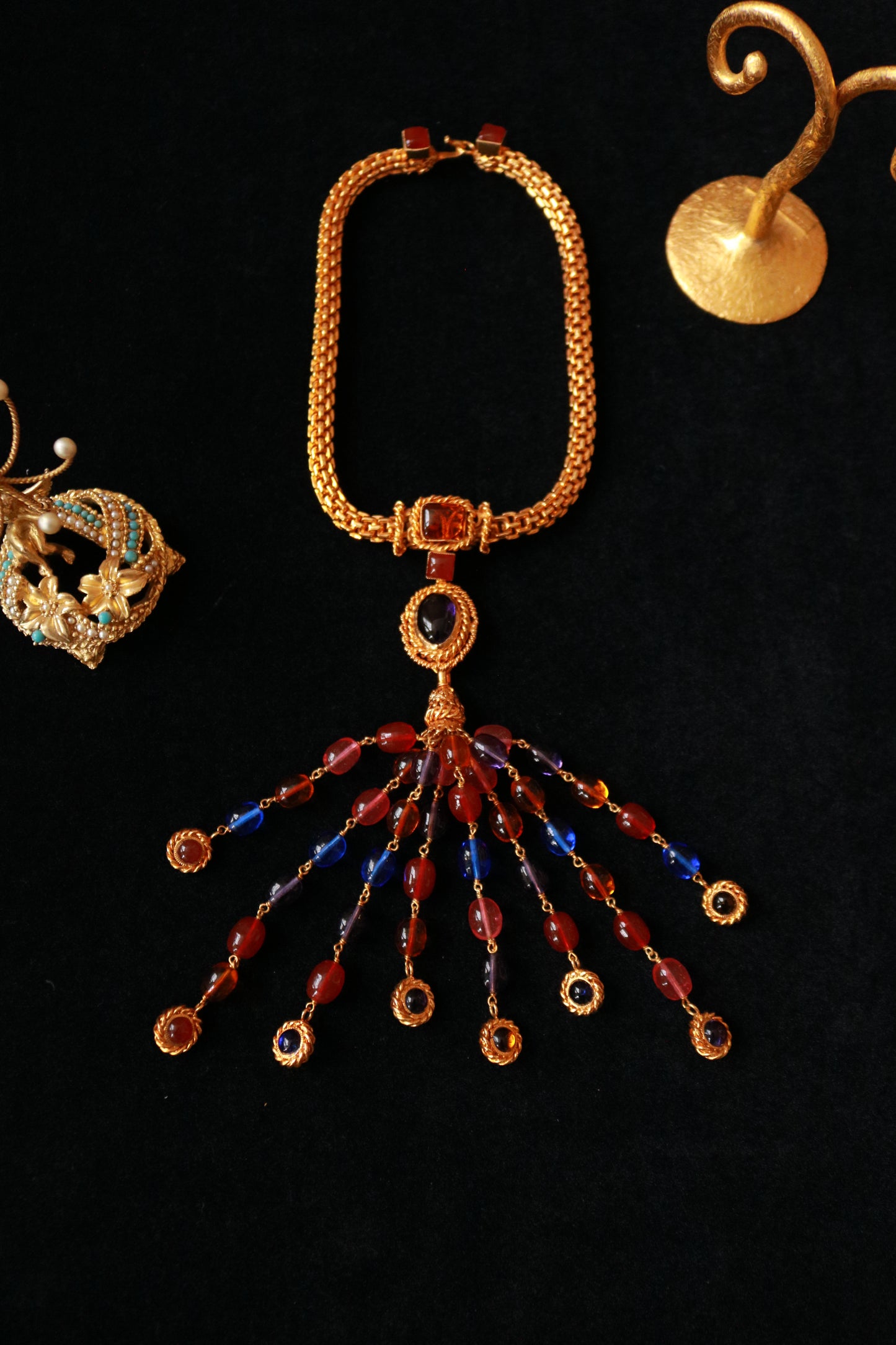 Authentic Chanel Haute Couture Gripoix necklace, 1980s, featuring red and blue handcrafted glass cabochons and a dramatic cascading pendant.